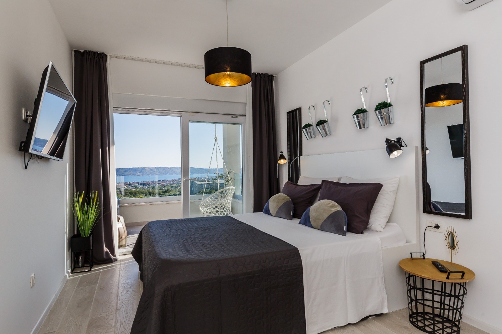 Double bedroom opening onto a balcony overlooking the Adriatic Sea